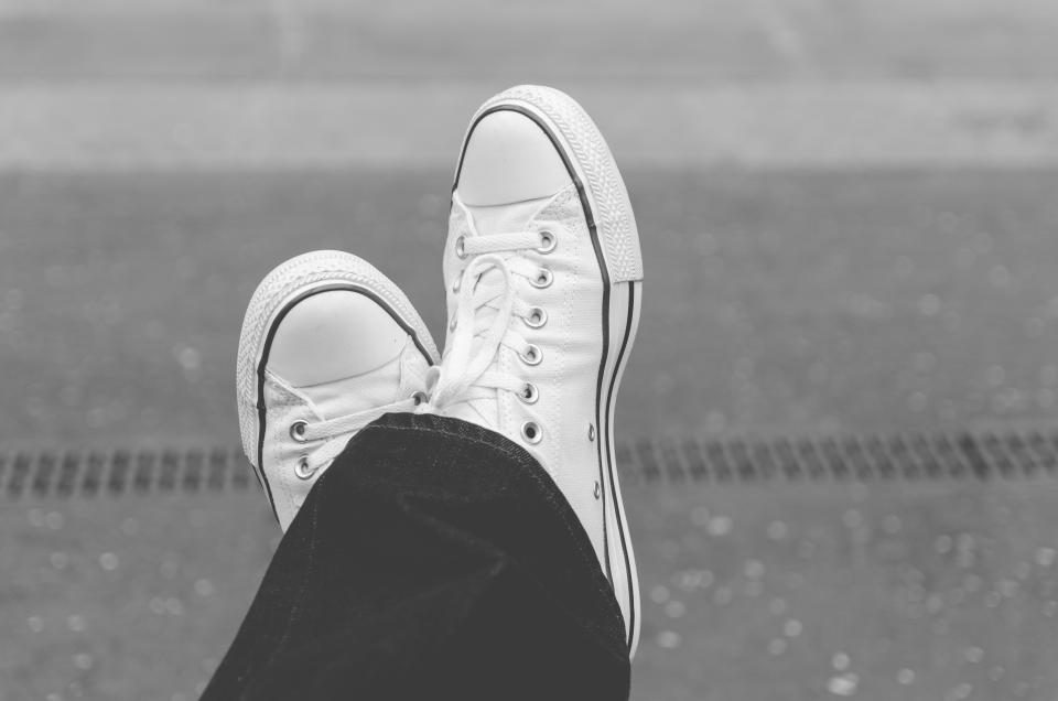 A pair of white trainers, the kind of sneakers UK resellers flip